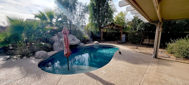 view of swimming pool with a gazebo and a patio