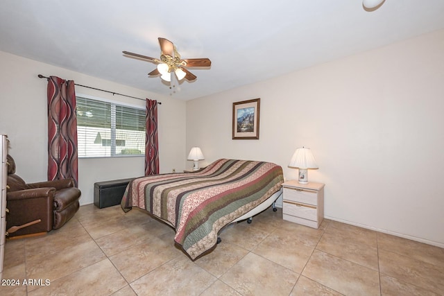 tiled bedroom featuring ceiling fan