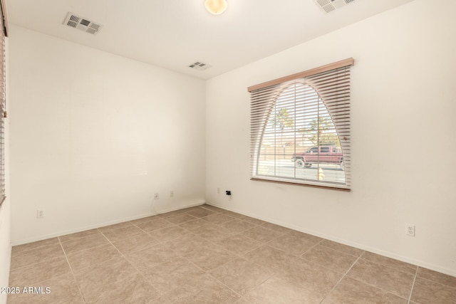 spare room with light tile patterned flooring