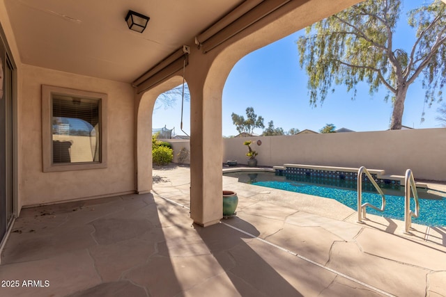 view of swimming pool with a patio