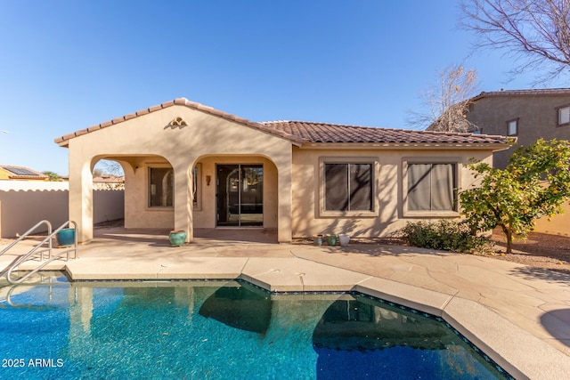 back of property featuring a patio