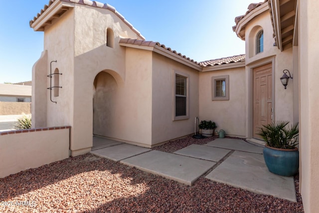 entrance to property with a patio