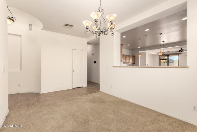 unfurnished living room with light colored carpet and ceiling fan with notable chandelier