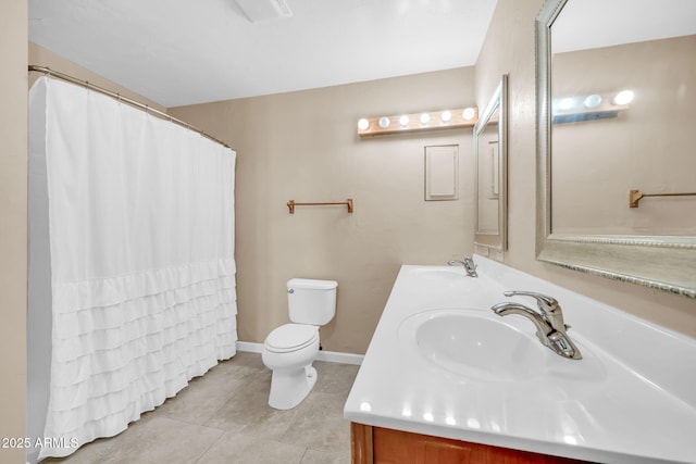 bathroom featuring vanity, tile patterned flooring, and toilet