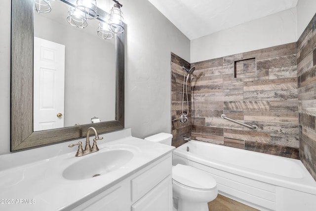 full bathroom with vanity, tiled shower / bath combo, toilet, and an inviting chandelier