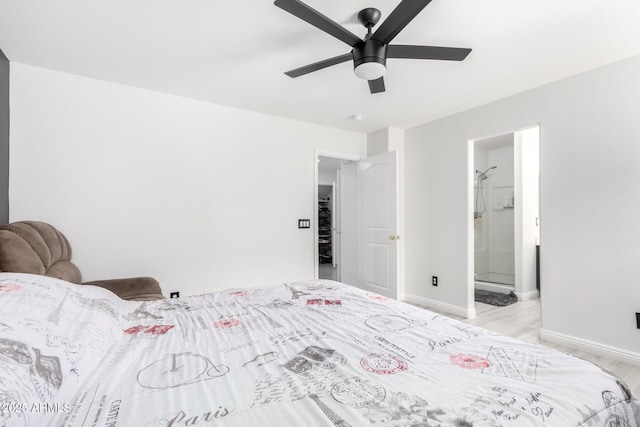 bedroom with ensuite bathroom and ceiling fan