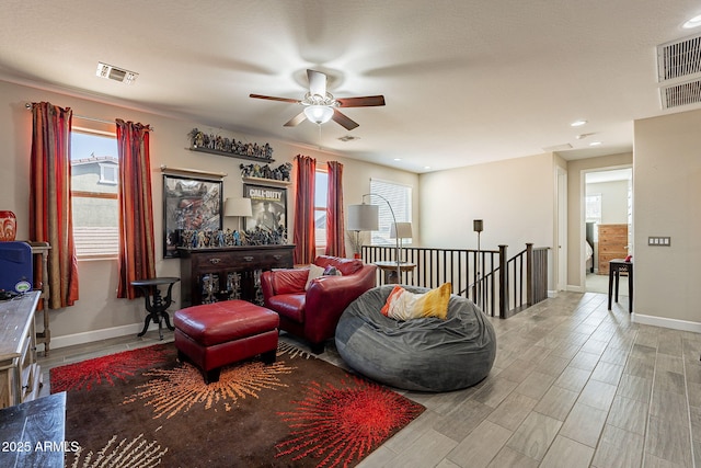5012 S Girard St, Gilbert, AZ 85298 - living room featuring a ceiling fan, visible vents, and a wealth of natural light