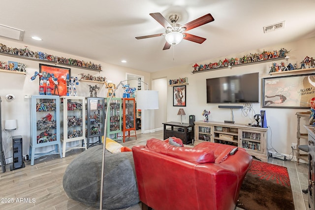 5012 S Girard St, Gilbert, AZ 85298 - living room with wood finished floors, ceiling fan, visible vents, and recessed lighting