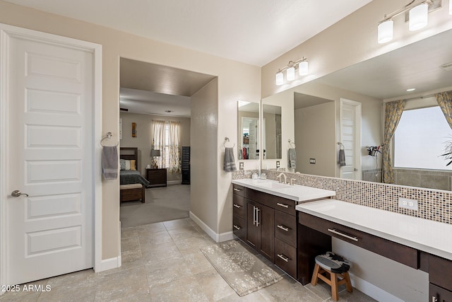 5012 S Girard St, Gilbert, AZ 85298 - bathroom featuring decorative backsplash, baseboards, ensuite bathroom, and vanity