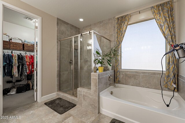 5012 S Girard St, Gilbert, AZ 85298 - bathroom with a spacious closet, a bath, visible vents, and a stall shower
