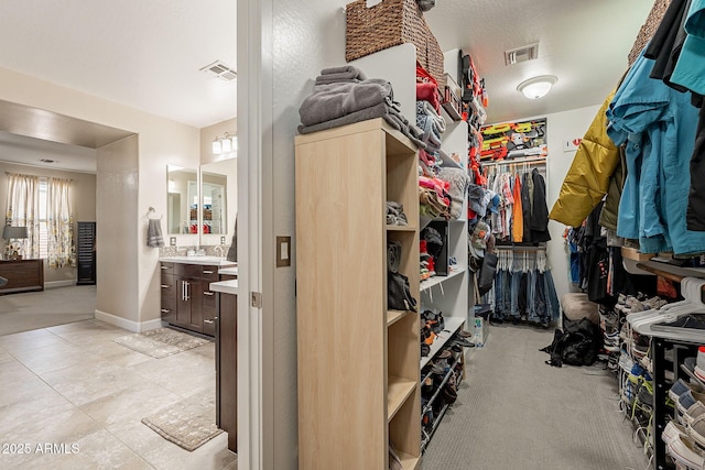 5012 S Girard St, Gilbert, AZ 85298 - spacious closet with visible vents and light tile patterned flooring