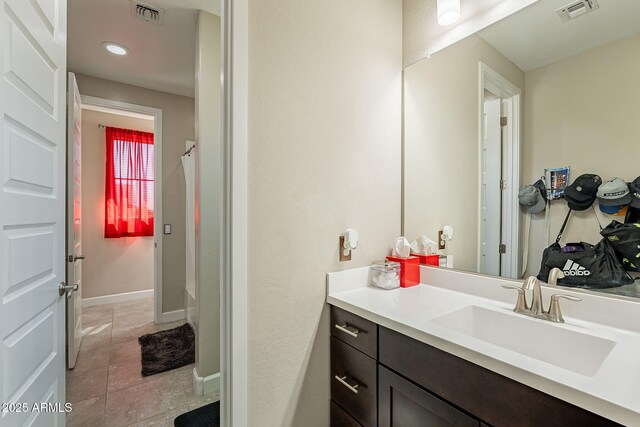 5012 S Girard St, Gilbert, AZ 85298 - full bath featuring vanity, tile patterned flooring, visible vents, and walk in shower
