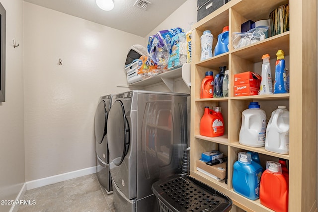 5012 S Girard St, Gilbert, AZ 85298 - clothes washing area featuring visible vents, washing machine and clothes dryer, laundry area, and baseboards