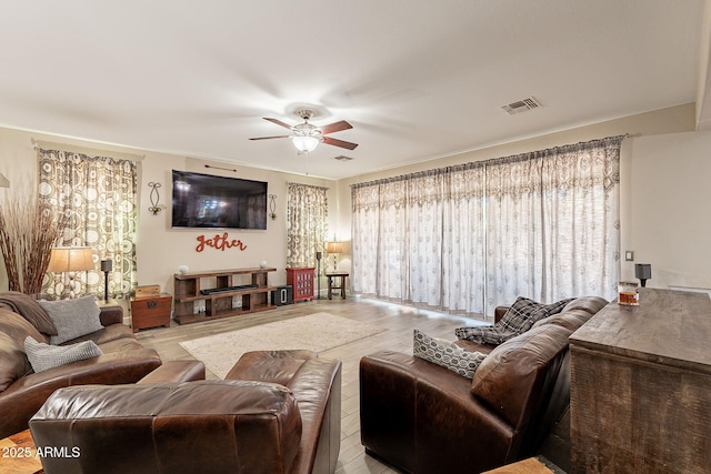 5012 S Girard St, Gilbert, AZ 85298 - living room featuring visible vents, ceiling fan, plenty of natural light, and wood finished floors