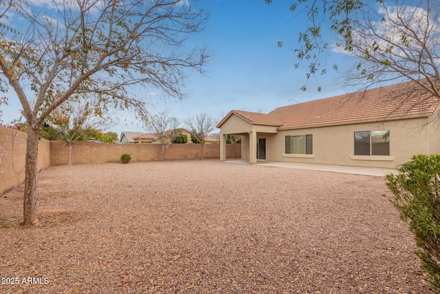 rear view of property featuring a patio area