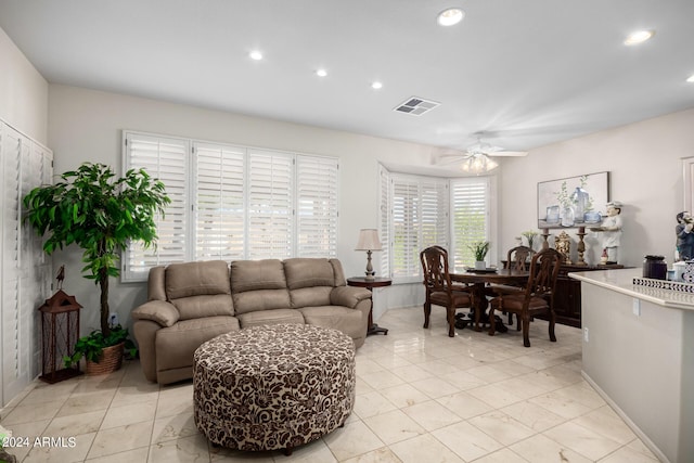 living room featuring visible vents, ceiling fan, recessed lighting, and baseboards