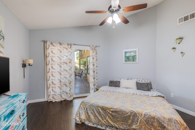 bedroom featuring dark wood-style flooring, visible vents, vaulted ceiling, and baseboards