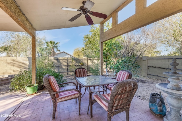 view of patio featuring a fenced backyard and a ceiling fan