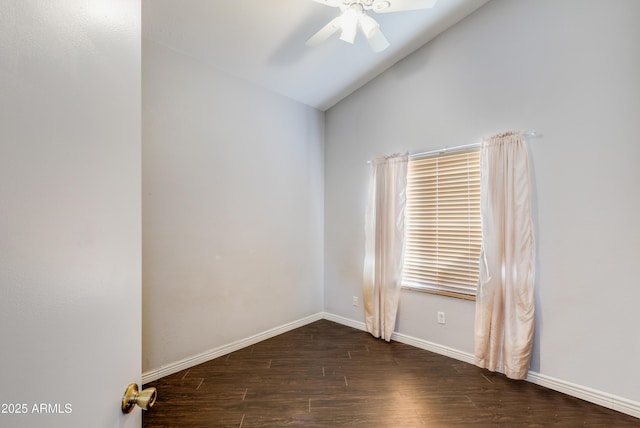 spare room with ceiling fan, dark hardwood / wood-style flooring, and lofted ceiling