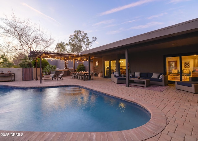 view of swimming pool with a fenced in pool, outdoor lounge area, a patio, and a pergola