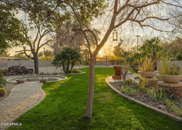 surrounding community featuring a lawn and fence