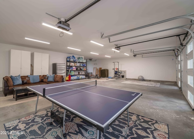 game room with a garage and concrete floors