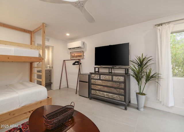 bedroom featuring visible vents, ceiling fan, freestanding refrigerator, a wall mounted air conditioner, and recessed lighting