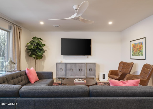 living area with ceiling fan, visible vents, and recessed lighting