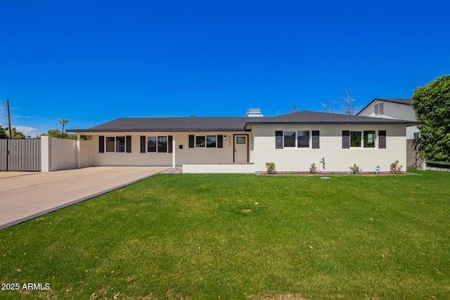 view of front of property with a patio, fence, stucco siding, a front lawn, and concrete driveway