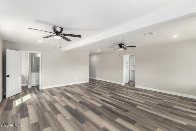 unfurnished room featuring wood finished floors, visible vents, baseboards, and ceiling fan