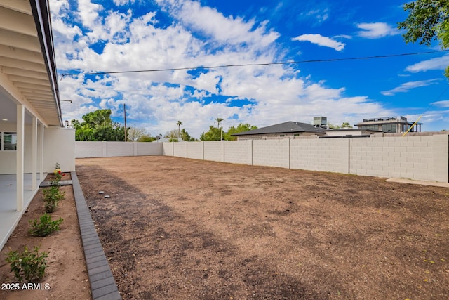 view of yard featuring a fenced backyard