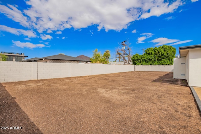 view of yard with a fenced backyard