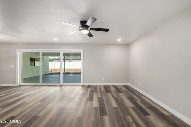 spare room featuring recessed lighting, a ceiling fan, baseboards, and wood finished floors