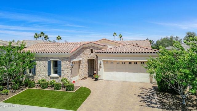 5542 E Alan Ln, Paradise Valley, AZ 85253 - view of front of home with an attached garage, stone siding, decorative driveway, a tiled roof, and a front yard