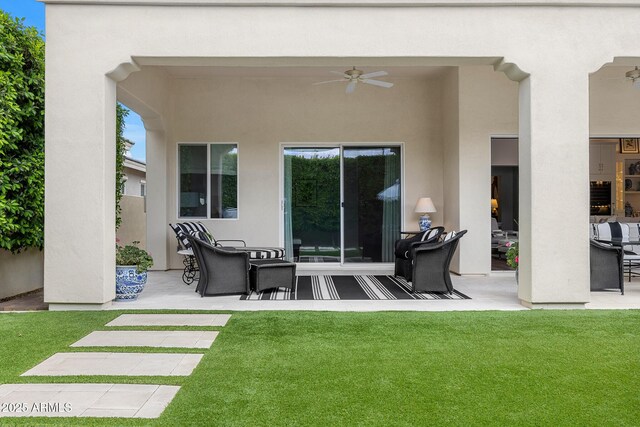5542 E Alan Ln, Paradise Valley, AZ 85253 - rear view of house featuring a ceiling fan, a patio area, a lawn, and stucco siding
