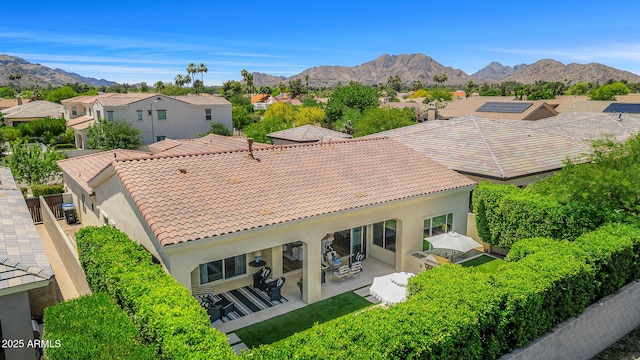 5542 E Alan Ln, Paradise Valley, AZ 85253 - back of house featuring a residential view, a tiled roof, a mountain view, stucco siding, and a patio area