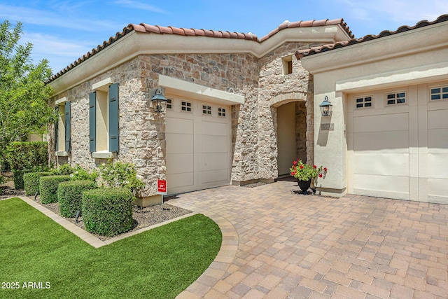 5542 E Alan Ln, Paradise Valley, AZ 85253 - view of front of property with stone siding, a tile roof, decorative driveway, and a garage