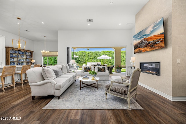 5542 E Alan Ln, Paradise Valley, AZ 85253 - living area with wood finished floors, a chandelier, a glass covered fireplace, recessed lighting, and a high ceiling