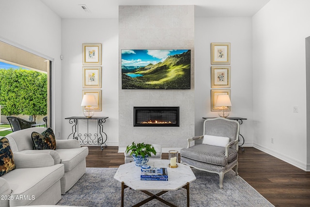 5542 E Alan Ln, Paradise Valley, AZ 85253 - living room featuring wood finished floors, a fireplace, and baseboards