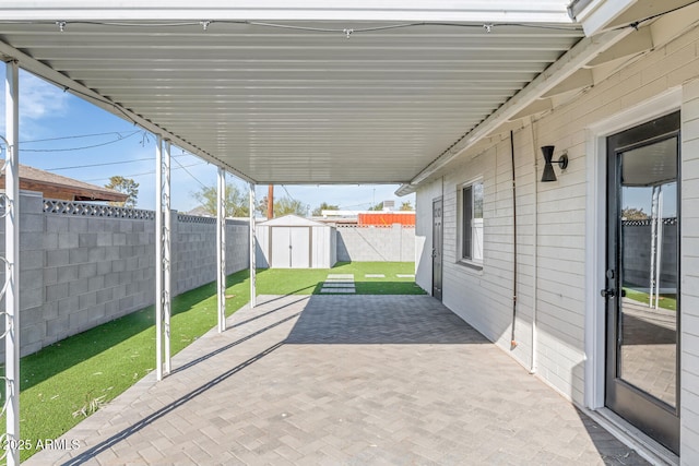 view of patio / terrace with a storage unit