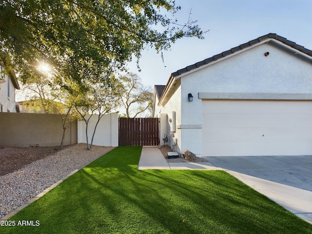 exterior space with a lawn and a garage