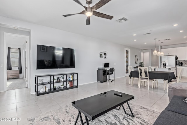 1005 W Lincoln Ave, Coolidge, AZ 85128 - living room with ceiling fan, recessed lighting, light tile patterned flooring, and baseboards