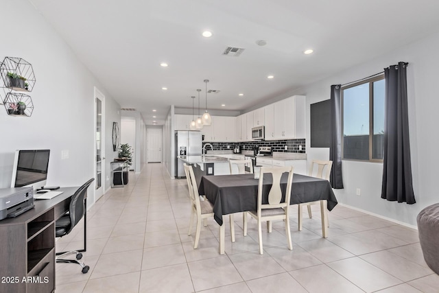 1005 W Lincoln Ave, Coolidge, AZ 85128 - dining area with recessed lighting, light tile patterned floors, baseboards, and an office area