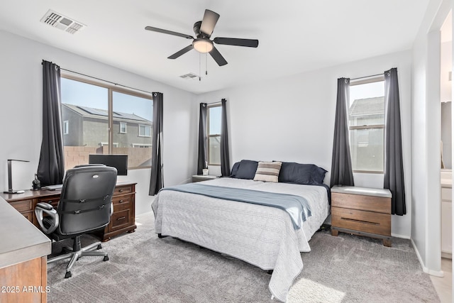 1005 W Lincoln Ave, Coolidge, AZ 85128 - bedroom featuring multiple windows, light colored carpet, a desk, and a ceiling fan