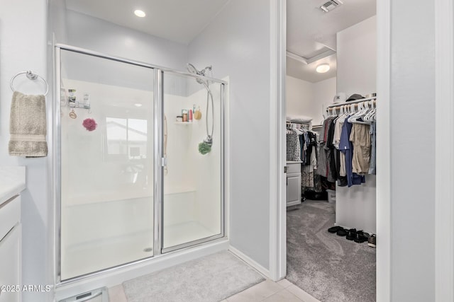1005 W Lincoln Ave, Coolidge, AZ 85128 - full bath with a shower stall, a spacious closet, tile patterned floors, vanity, and baseboards