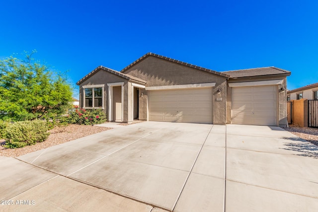 1005 W Lincoln Ave, Coolidge, AZ 85128 - ranch-style home with an attached garage, driveway, stucco siding, and a tile roof