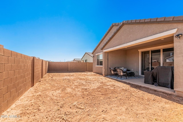 1005 W Lincoln Ave, Coolidge, AZ 85128 - fenced backyard with a patio area