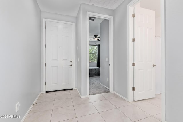 1005 W Lincoln Ave, Coolidge, AZ 85128 - foyer entrance with baseboards, a ceiling fan, and light tile patterned floors