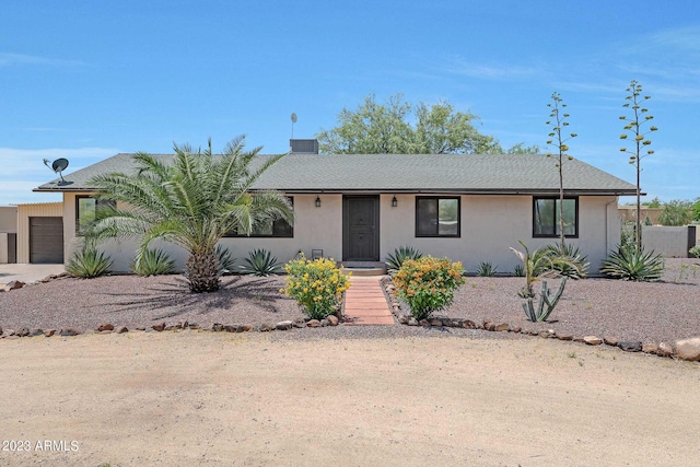 ranch-style home featuring a garage