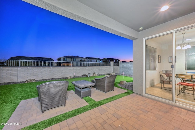 patio terrace at dusk with an outdoor living space